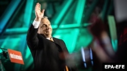 Hungarian Prime Minister Viktor Orban waves to his supporters during a ruling Fidesz party event after the elections on April 3.