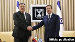 Israel - Israeli President Isaac Herzog (right) meets with new Armenian Ambassador Arman Hakobian, April 7, 2022.