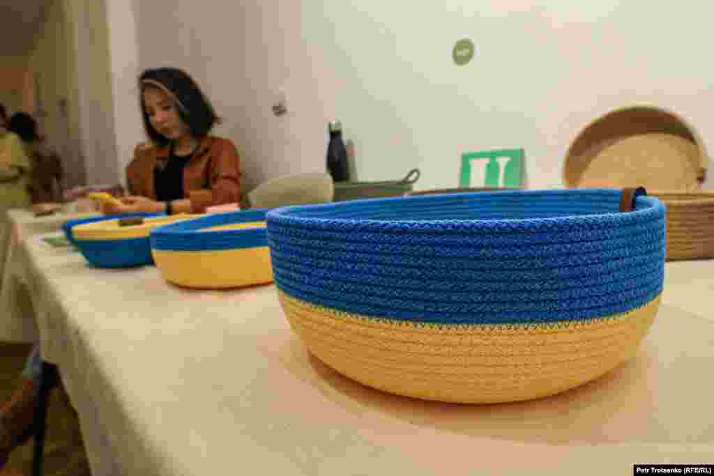 Handmade bowls on offer made in the blue and yellow of Ukraine.