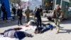 Rescue personnel tend to victims of a Russian attack on the railway station in the eastern city of Kramatorsk on April 8.