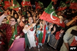 Supporters of the PTI rally in support of Khan in Lahore on April 10.