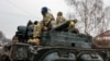 Members of the Ukrainian military advance near Nova Basan in the Chernihiv region earlier this month.