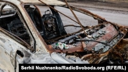 A destroyed civilian car in Nova Basan (file photo)