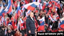 Președintele rus Vladimir Putin la un concert care marca opt ani de la anexarea de către Rusia a peninsulei ucrainene, stadionul Lujhniki, Moscova, 18 martie 2022.