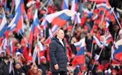 Vladimir Putin, la un concert care marchează opt ani de la anexarea Crimeei, pe stadionul Luzhniki din Moscova, 18 martie 2022.