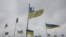 National flags wave over the graves of Ukrainian soldiers at a cemetery in Chernihiv on April 6.
