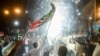 People celebrate on the streets of Karachi following the Supreme Court's April 7 ruling, which overturned Prime Minister Imran Khan's move to block a no-confidence vote and dissolve the parliament.