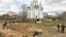 Bodies of civilians exhumed from a mass grave lay in plastic bags in Bucha, near Kyiv, which was recaptured by the Ukrainian Army from Russian forces, who are accused of committing war crimes.
