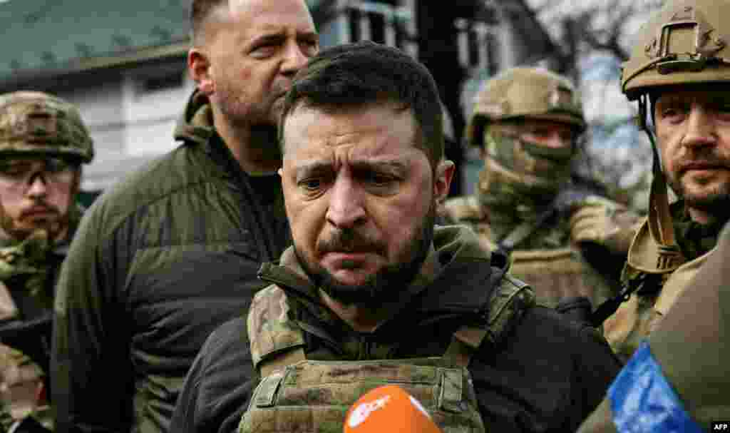 A pained Ukrainian President Volodymyr Zelenskiy speaks to reporters after witnessing firsthand the bodies of civilians littering the streets in the town of Bucha, northwest of the Ukrainian capital, Kyiv, on April 4. He accused Russian troops of committing war crimes in the town.