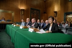 Omarova (right) at a senate committee hearing in 2018.