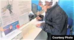 Chernysheva collects her Kazakh identity card on October 8.