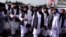 Members of the Taliban leadership walk in Kabul after the militants took control of the capital in August 2021.