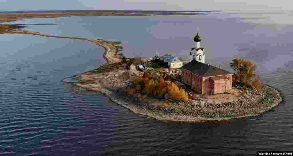 An aerial autumn view of the Spaso-Kamenny Monastery on Kubenskoye Lake in Russia&#39;s Vologda Region