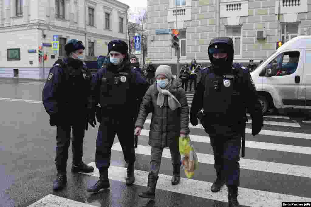 Police detain an elderly protester next to Russia&#39;s Supreme Court in Moscow on November 25. The court was hearing a petition to shut down Memorial, one of the country&#39;s oldest and most prominent human rights groups, a move that has sparked public outrage.