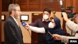 Iranian Deputy Foreign Minister Ali Bagheri speaks with reporters after informal meetings with the Chinese and Russian delegations to negotiations in Vienna to revive the 2015 Iran nuclear deal.