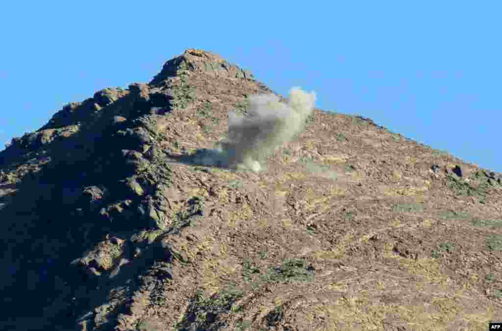 A shell bursts on a mountainside during fighting between fighters loyal to Yemen&#39;s government and Huthi fighters.&nbsp;After the &quot;Arab Spring&quot; protests that swept much of the Middle East in 2011, Huthi militias began to seize control of territory in Yemen and in 2015 they overthrew the country&#39;s president to seize the capital, Sanaa.&nbsp;