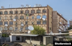 An apartment covered in satellite television dishes in Mary, Turkmenistan. Since this 2015 photo was taken, Turkmen authorities launched a crackdown on satellite dishes.