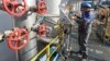 A technician checks equipment at the Slavyanskaya compressor station, the starting point of the Nord Stream 2 natural gas pipeline
