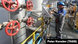 A technician checks equipment at the Slavyanskaya compressor station, the starting point of the Nord Stream 2 natural gas pipeline