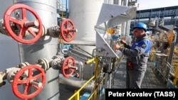 A worker checks measuring equipment at the Slavyanskaya compressor station, the starting point of the Nord Stream 2 pipeline.