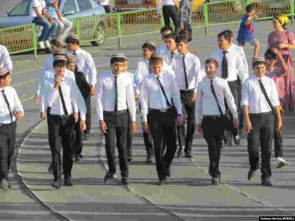 Turkmen schoolboys (most of them wearing traditional caps) take part in Independence Day rehearsals.
