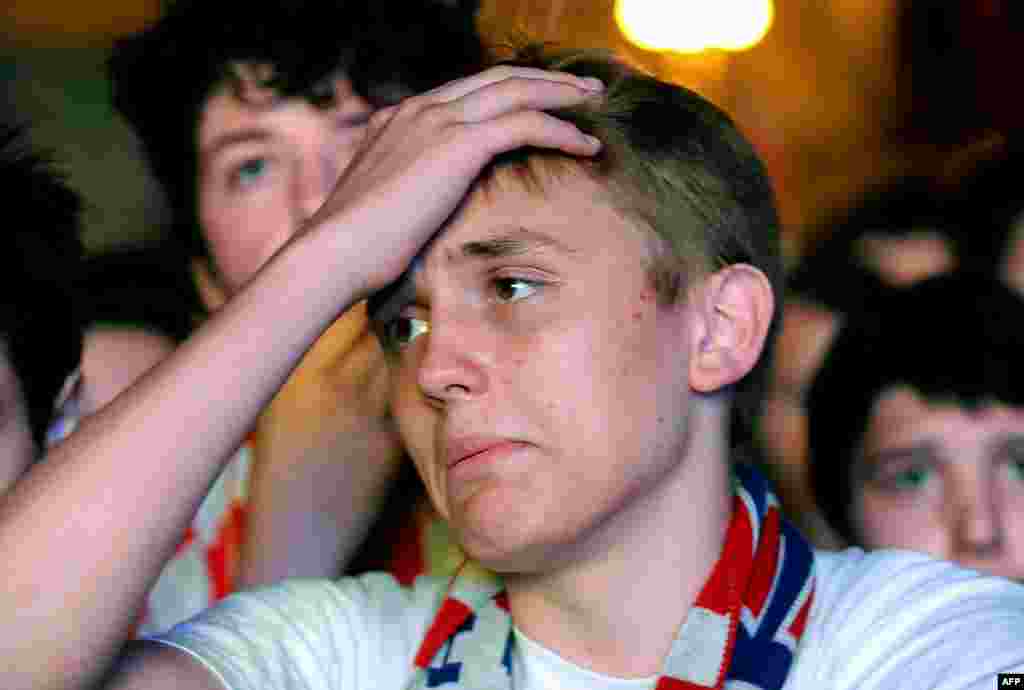 Croatia -- A Croatian soccer fan reacts as he watches the opening match of the 2014 FIFA World Cup, a group A football match between Croatia and Brazil, on Zagreb's main square, June 12, 2014
