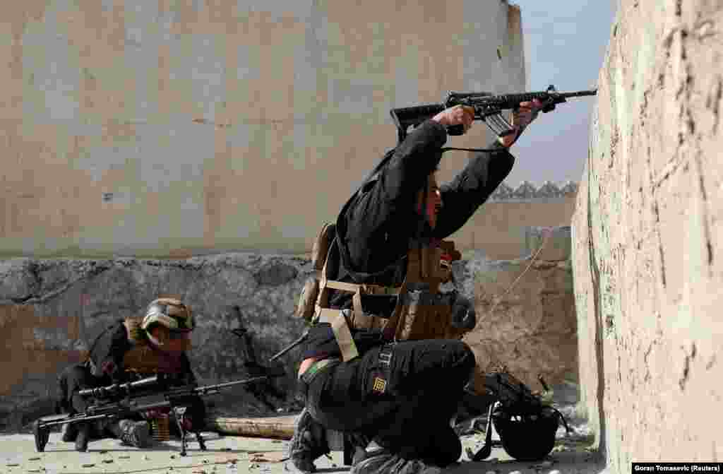An Iraqi special forces soldier fires at Islamic State fighters' positions on February 28. Mosul is today the last urban stronghold for Islamic State in Iraq. 