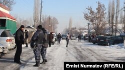 Kyrgyz authorities at the scene after the violence broke out between local residents in Uzgen and workers from China on January 9.