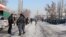 Kyrgyz authorities at the scene after the violence broke out between local residents in Uzgen and workers from China on January 9.