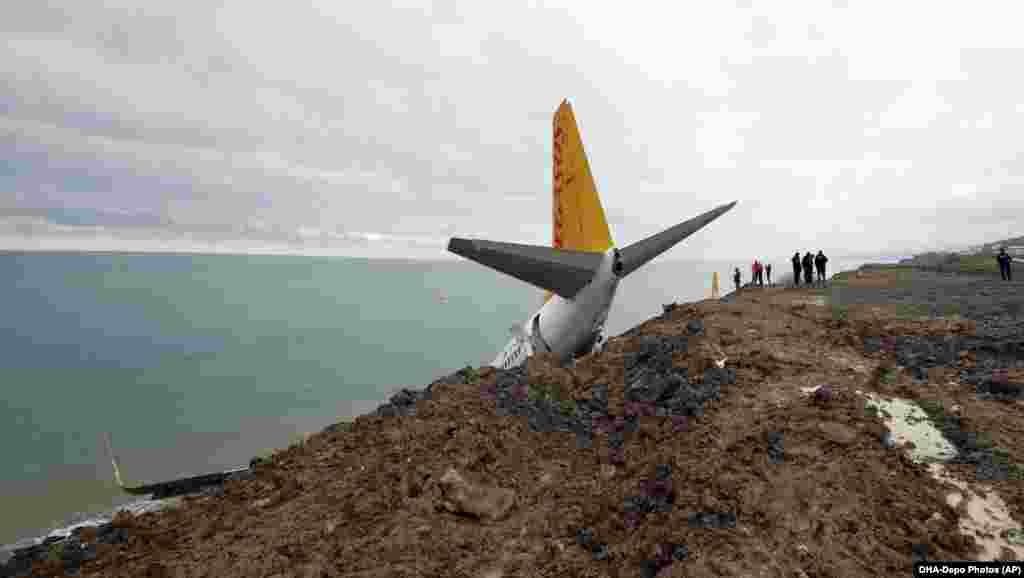 A Turkish Pegasus Airlines 737-800 that skipped off the runway in Trabzon lies stricken on the edge of a cliff on January 135. Miraculously, none of the 162 people on board was seriously injured and the plane was safely removed on January 18. (AP)