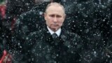 RUSSIA – Snow falls as Russian President Vladimir Putin attends a wreath-laying ceremony at the Tomb of the Unknown Soldier in Moscow, Feb. 23, 2017