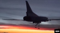 A Russian Tupolev TU-22M3 heavy bomber conducts an air strike at an unknown location in Syria late last year.