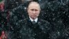 RUSSIA – Snow falls as Russian President Vladimir Putin attends a wreath-laying ceremony at the Tomb of the Unknown Soldier in Moscow, Feb. 23, 2017