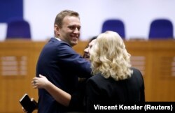 Navalny and his lawyers react after the judgment in Strasbourg on November 15.