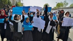 Afghan women and girls take part in a protest demanding that high schools be reopened for girls. 