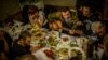 <p>Rebel field commander&nbsp;Igor Bezler, who is known to his comrades&nbsp;as &quot;Bes,&quot;&nbsp;plays guitar at the wedding of one of his unit members in Gorlovka, in the Donetsk region.</p>
