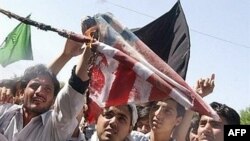 Afghan protestors burn a U.S. flag during a demonstration over civilian deaths in Jalalabad in 2007.