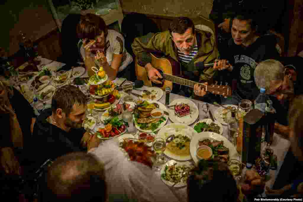 Rebel field commander&nbsp;Igor Bezler, who is known to his comrades&nbsp;as &quot;Bes,&quot;&nbsp;plays guitar at the wedding of one of his unit members in Gorlovka, in the Donetsk region. 