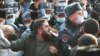 Armenia - Relatives of Armenian POWs clash with riot police outside the parliament building in Yerevan, December 8, 2021.