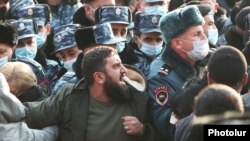 Armenia - Relatives of Armenian POWs clash with riot police outside the parliament building in Yerevan, December 8, 2021.