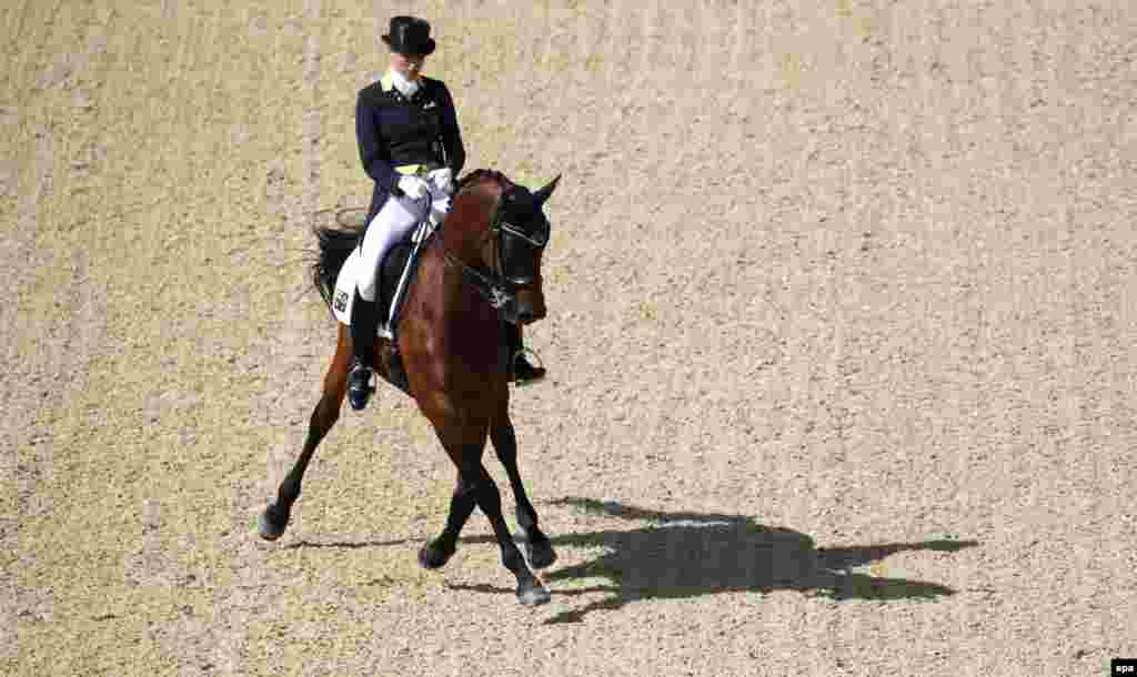 Lyndal Oatley from Australia rides Sandro Boy 9 in the dressage event. &nbsp;