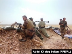 Бойцы отрядов пешмерга на севере Ирака. Сентябрь 2014 года