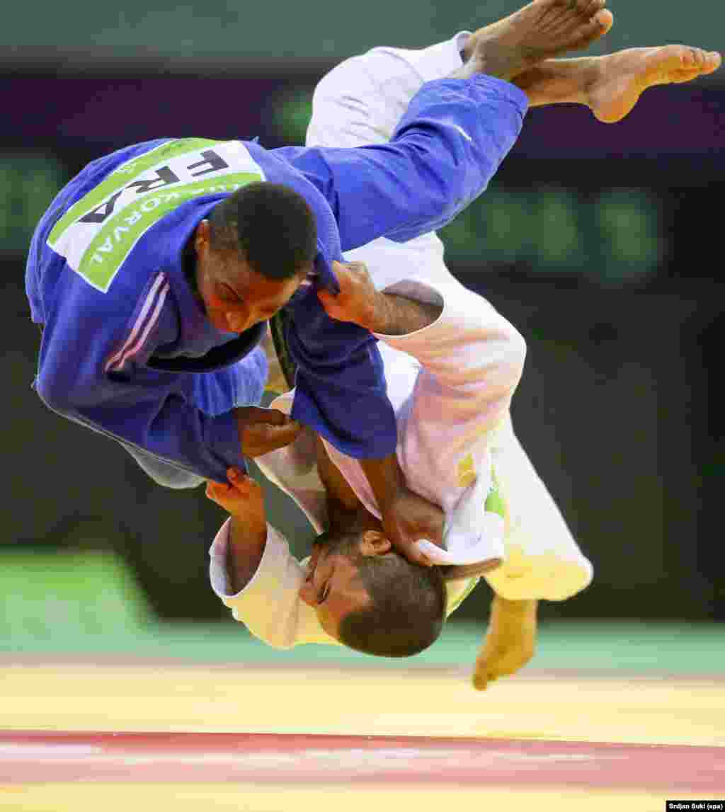 In recent years, Suki&rsquo;s work focused largely on sports and everyday life. In this photo, two finalists tumble spectacularly in the men&#39;s 66-kilogram judo contest at the Baku 2015 European Games in Azerbaijan. &nbsp;