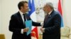 French President Emmanuel Macron (left) and Armenian Prime Minister Nikol Pashinian talk in Djerba, Tunisia., on November 19.