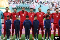 Iran's national soccer team chose not to sing their country's anthem before their opening World Cup match against England on November 21, in an apparent show of support for protesters back home.