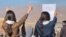 Three Iranian girls show their solidarity with protesters in the Kurdish city of Mahabad earlier this month amid the nationwide protests.