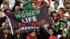 Iran fans hold a banner reading "Women, Life, Freedom" inside the stadium during Iran's first match in the World Cup in Qatar on November 21.