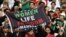 Iran fans hold a banner reading "Women, Life, Freedom" inside the stadium during Iran's first match in the World Cup in Qatar on November 21.