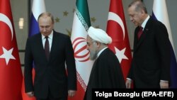 Presidents Vladimir Putin (left) of Russia, Hassan Rohani (center) of Iran, and Recep Tayyip Erdogan of Turkey are set to meet in Sochi on February 14. (file photo)