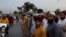 Supporters of Pakistani firebrand cleric Maulana Fazlur Rehman, head of the Jamiat Ulema-i-Islam party, chant slogans as they wait to greet him on the outskirts of Islamabad on October 31.